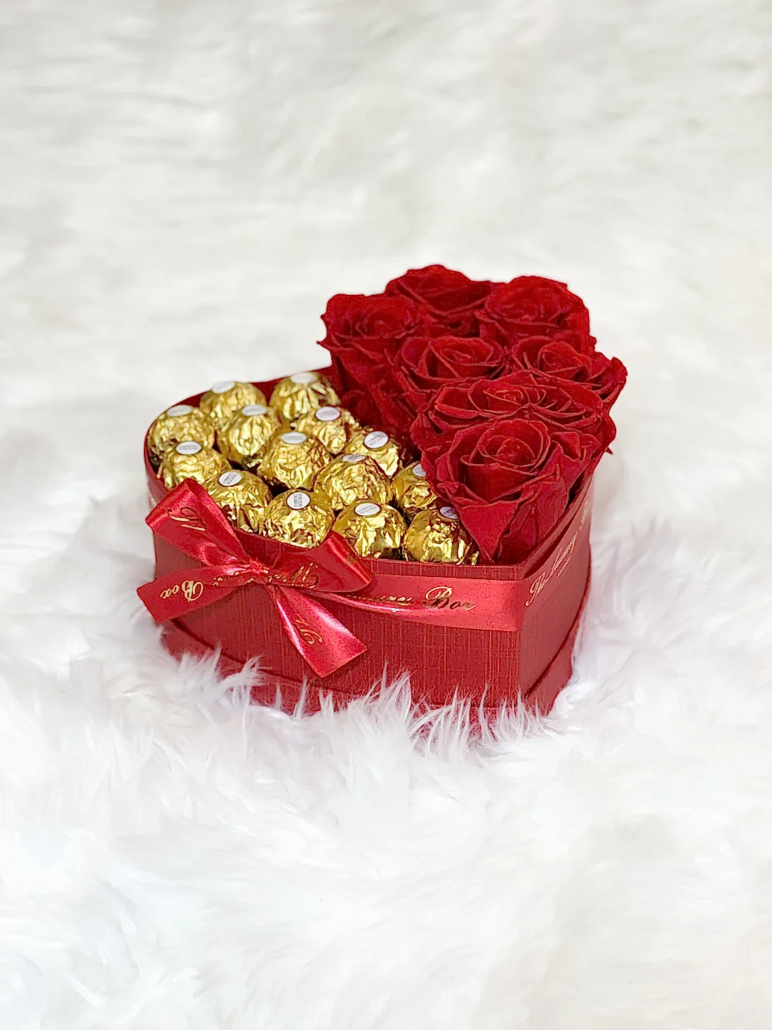 Red infinity roses and chocolate for Valentine's Day delivery in heart shaped box