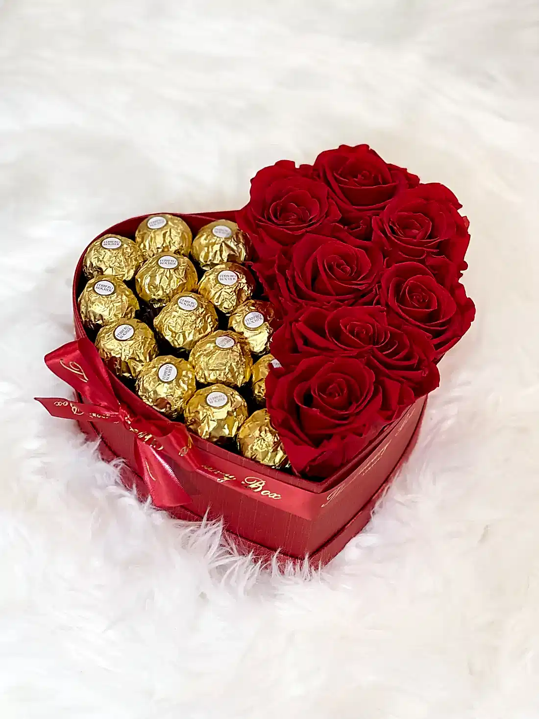 Red infinity roses and chocolate for Valentine's Day delivery in heart shaped box