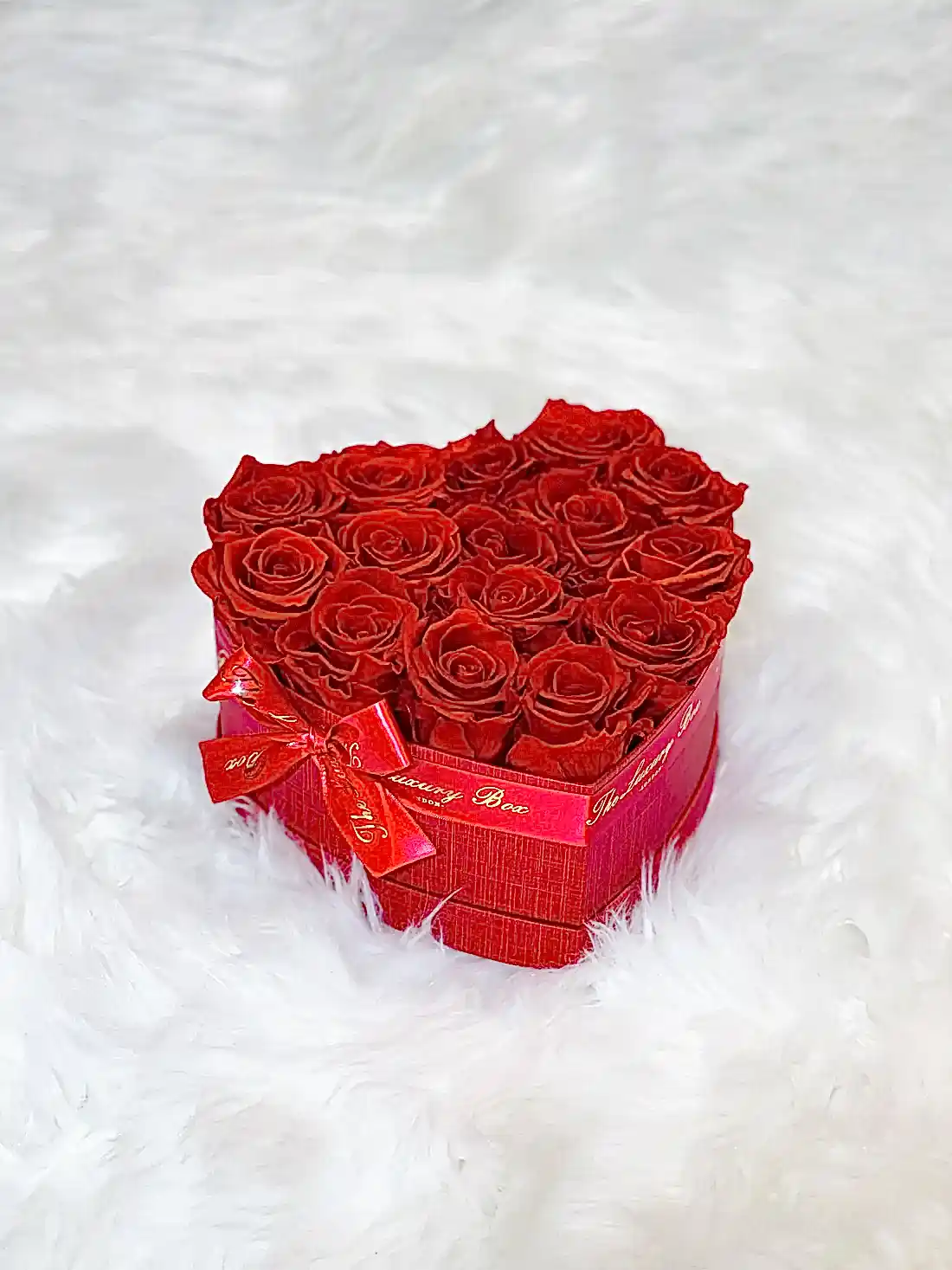 Red infinity roses for Valentine's Day delivery in heart shaped box
