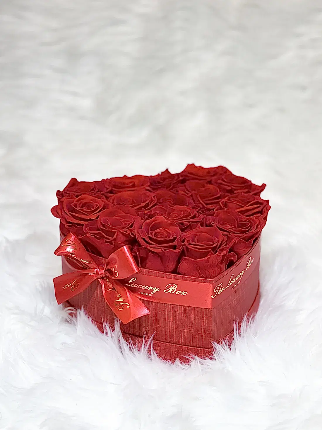 Red infinity roses for Valentine's Day delivery in heart shaped box