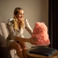 woman with gift for her pink rose teddy bear