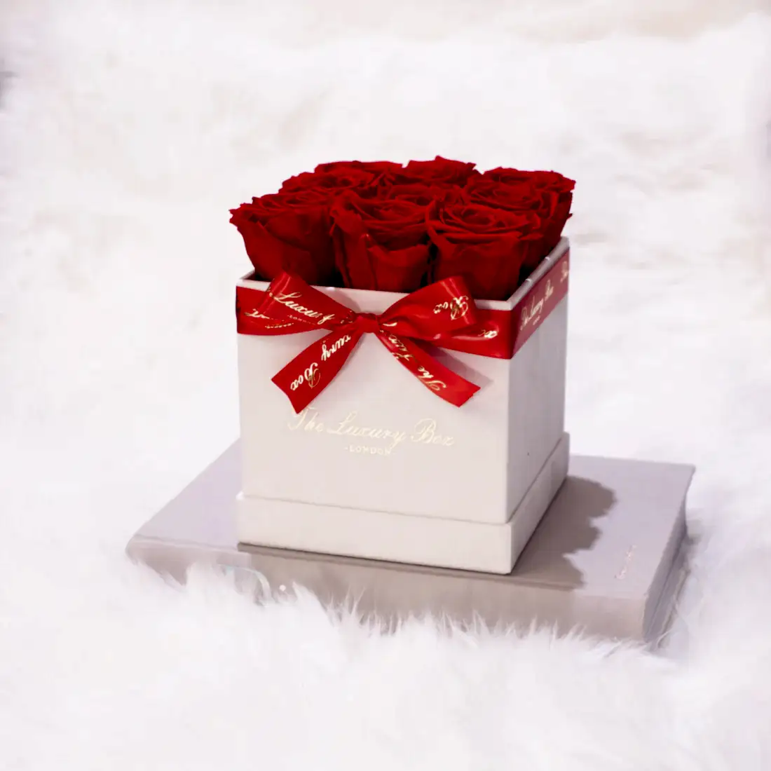 red eternity roses in white square rose box