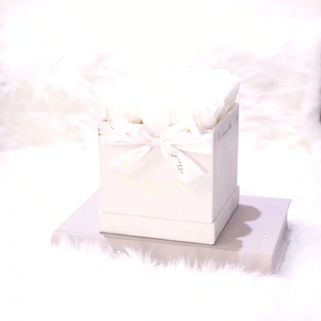 white infinity roses in white square rose box