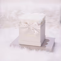 white infinity roses in white square rose box