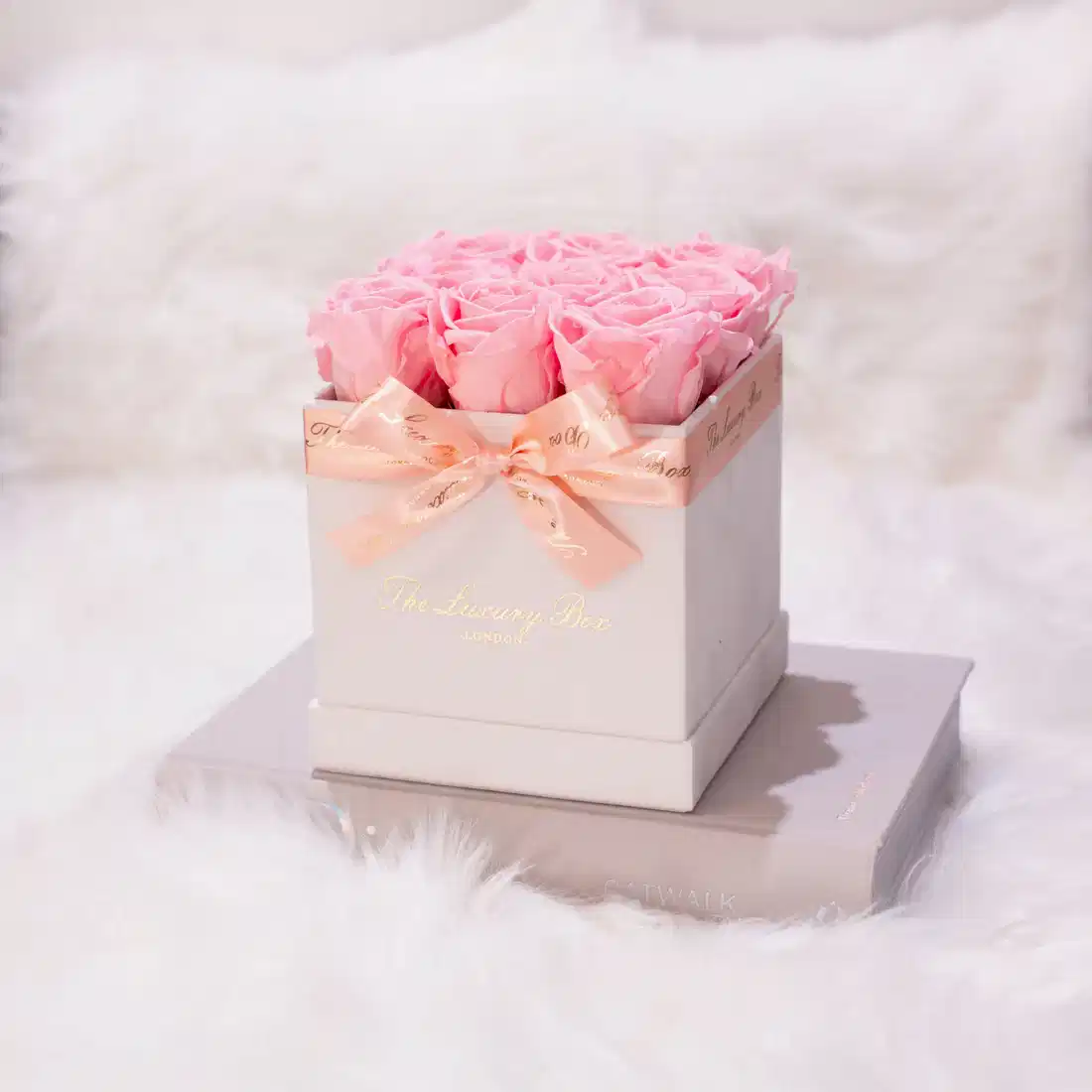 pink infinity roses in white square rose box