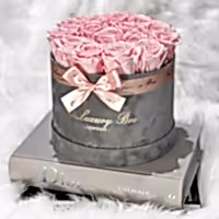 pink eternity roses in grey velvet box