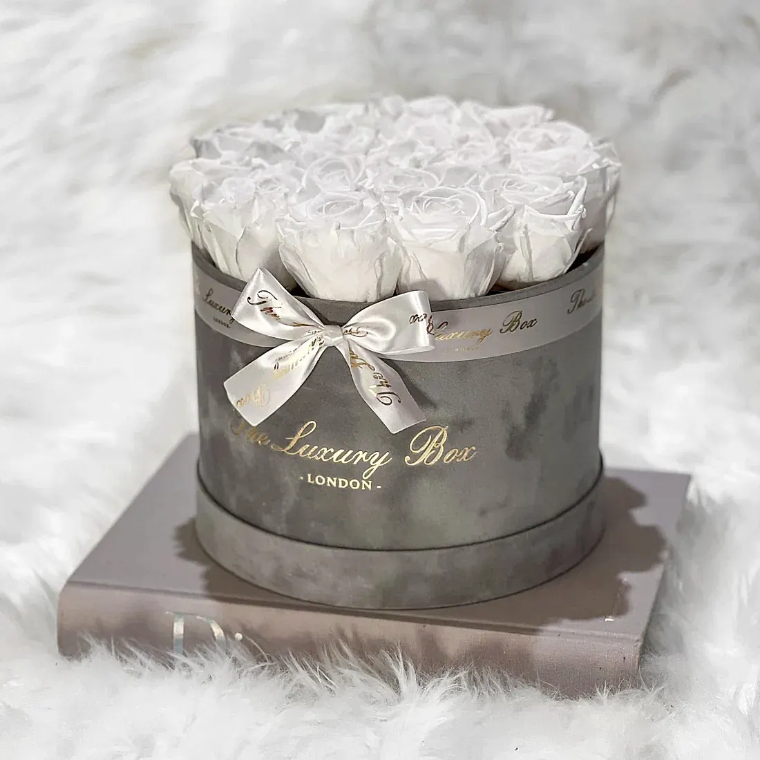 red eternity roses in grey velvet box